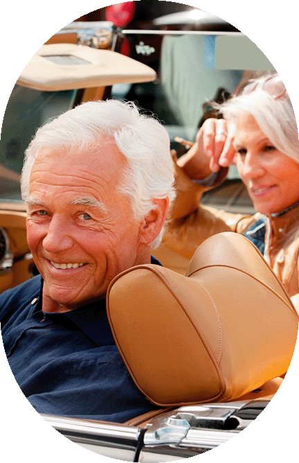 2 seniors man and women in caonvertable car