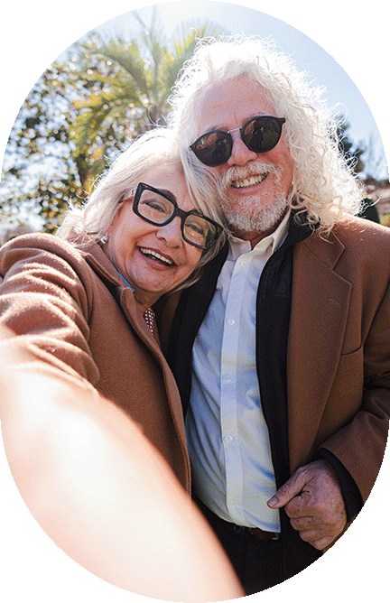happy senior couple taking a selfie