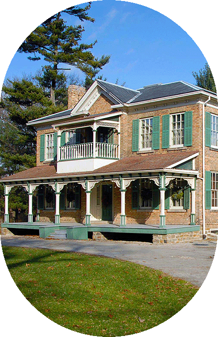 Historic house with porch and greenery